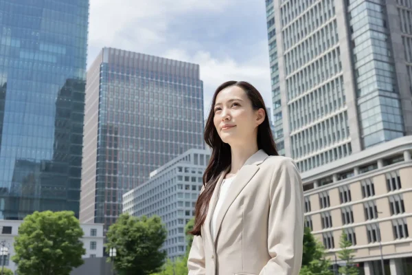 woman-standing-near-business-buildings-international
